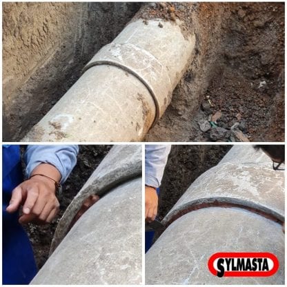 An asbestos cement pipe in Mexico undergoes repair using Superfast Copper Epoxy Putty Stick to plug gaps between a sleeve and the surface of the pipe