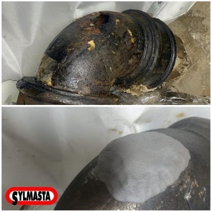 A large crack in a cast iron pipe is repaired using Superfast Steel