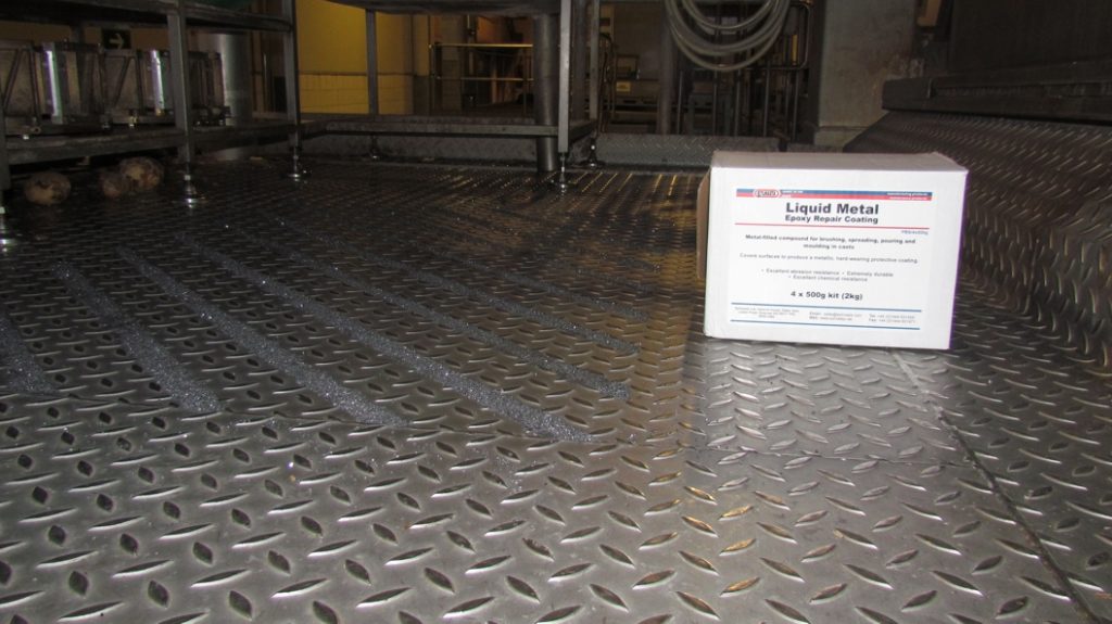 Liquid Metal and silicone carbide grit are used to create anti slip flooring at the PepsiCo industrial plant in Chile