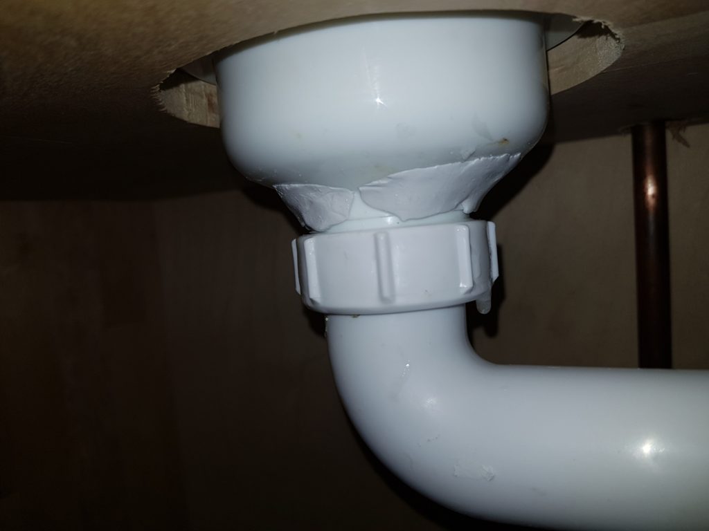 Completed leak repair of a plastic PVC pipe suffering from cracks where it connected to a bathroom sink