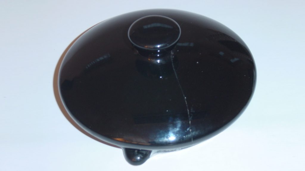 A ceramic teapot lid having undergone repair using Sylmasta Rapid 5 Minute Epoxy Adhesive