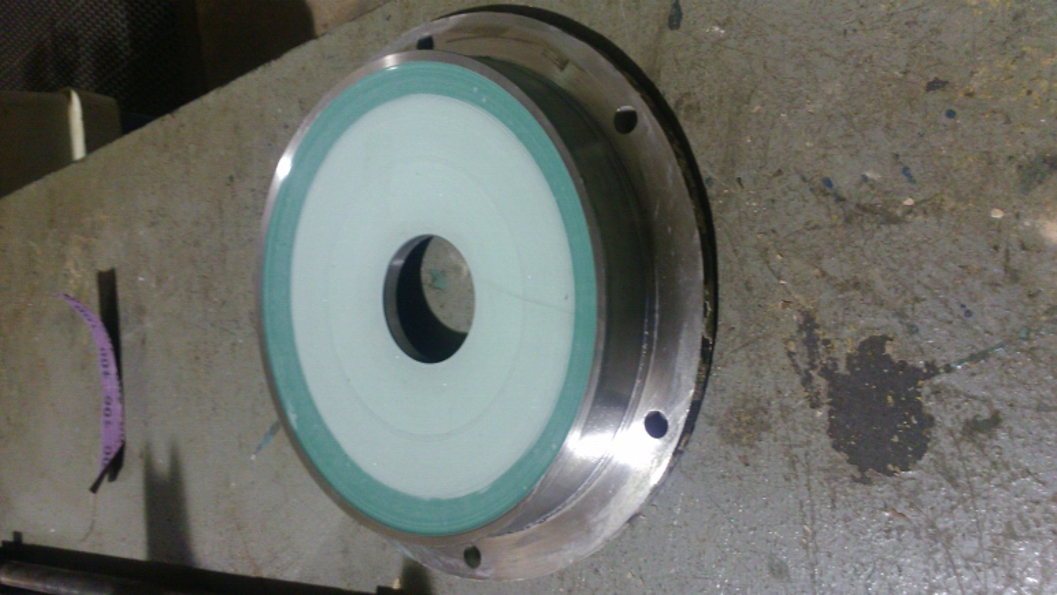 Ceramic Brushable Green Epoxy Coating is used to repair a badly damaged Alloy 20 pump lid at a power station water treatment plant