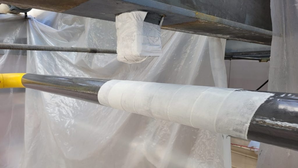 SylWrap HD Pipe Repair Bandage applied to a heavily corroded steel natural gas pipe