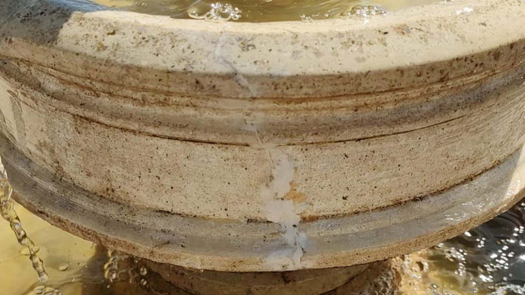 Cracks in a stone water fountain are barely visible after repair using Sylmasta AB Epoxy Putty