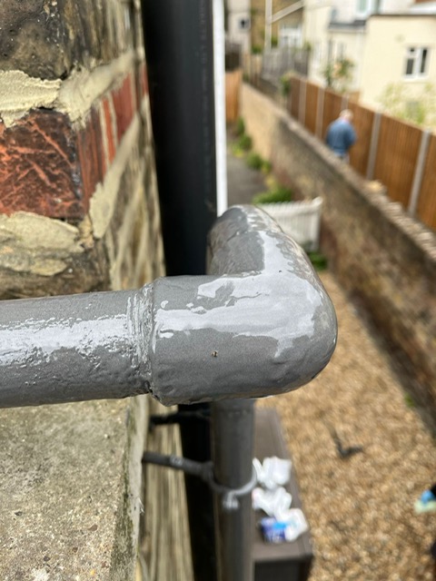 Liquid Metal coated around a bend in the repair of a shared water supply line