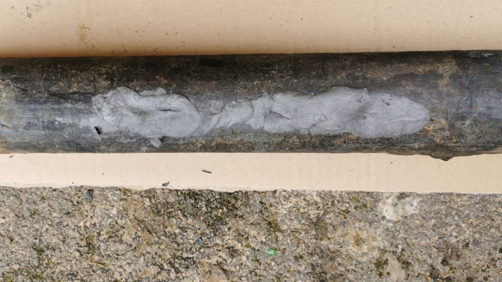 Superfast Steel Epoxy Putty Stick used to repair deep cracks in a steel pipe