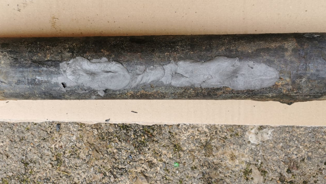 Superfast Steel Epoxy Putty Stick used to repair deep cracks in a steel pipe