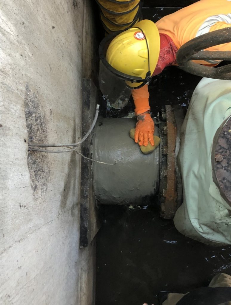 Industrial Metal Epoxy Paste used to repair a hole in a corroded sewer main line