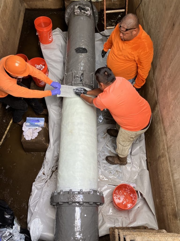 Application of SylWrap Pipe Repair Bandage to a heavily corroded sewer main pipe in Hawaii