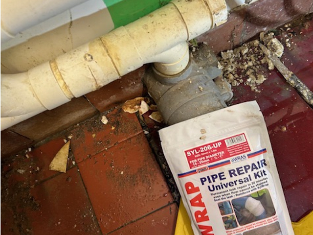 SylWrap Universal Pipe Repair Kit used to seal a leaking 50mm plastic pipe attached to a dishwasher at a golf club