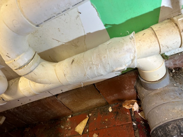 SylWrap HD Pipe Repair Bandage applied around a leaking dishwasher pipe at a golf club
