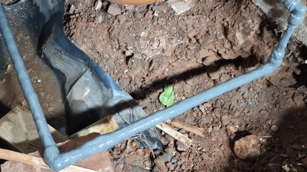 Liquid Metal Epoxy Coating painted onto a pipe to refurbish after heavy corrosion in a domestic water main pipe repair