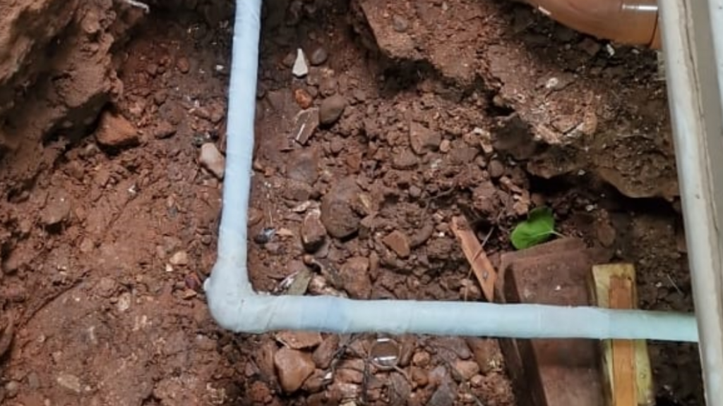 SylWrap HD Pipe Repair Bandage used as a final layer of rock hard protection in a domestic water main pipe repair damaged by corrosion and imbedded stones