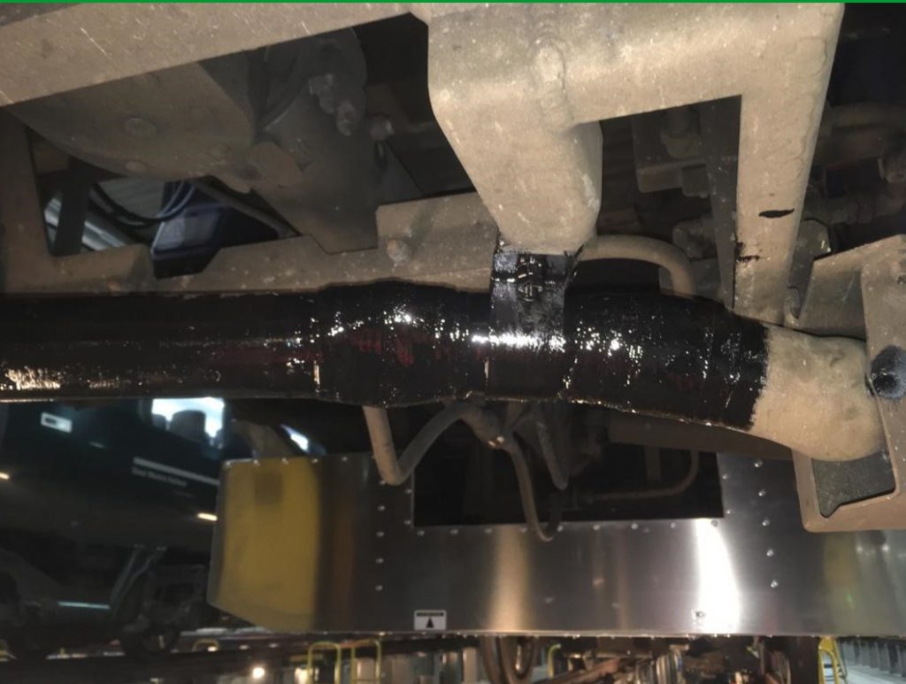 SylWrap HD Pipe Repair Bandage used to reinforce and protect aluminium conduit pipe attached underneath a train
