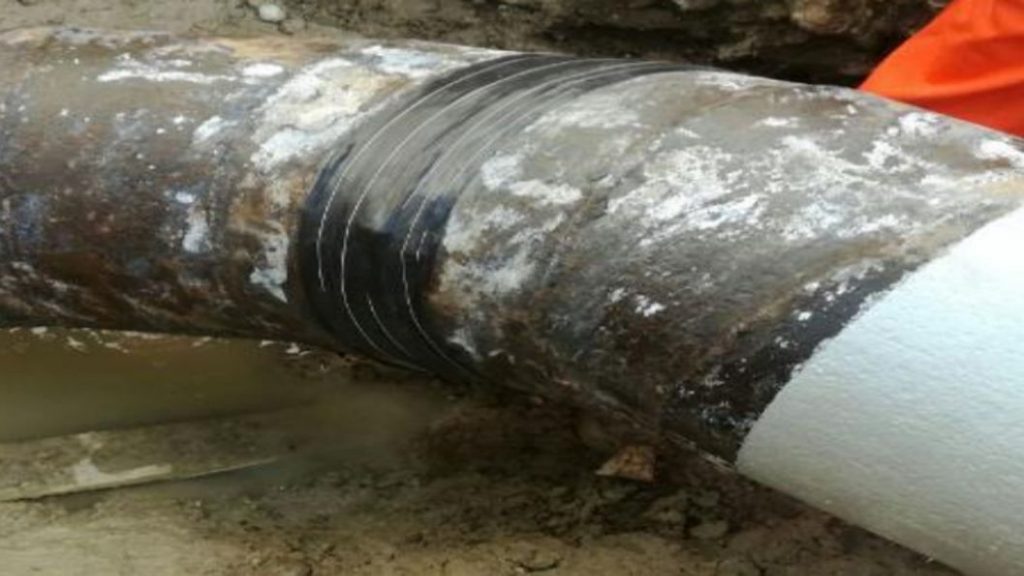 Wrap & Seal Pipe Burst Tape wrapped around a 300mm steel pipe to seal a live leak at a wastewater treatment plant in Mexico