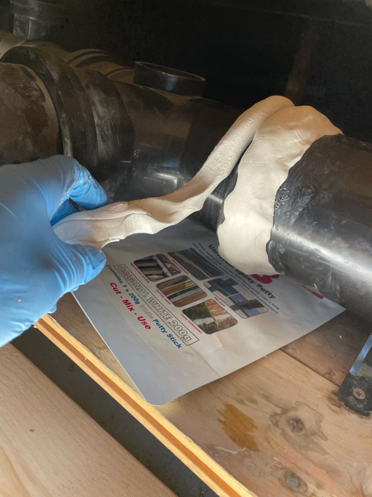 AB Original Epoxy Putty applied to repair a plastic pipe joint leaking through solvent cement failure