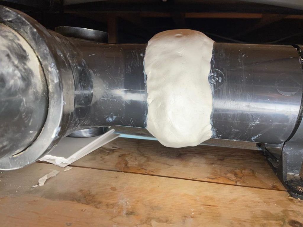 AB Original Epoxy Putty seals all around a leaking plastic pipe joint to repair a solvent cement failure