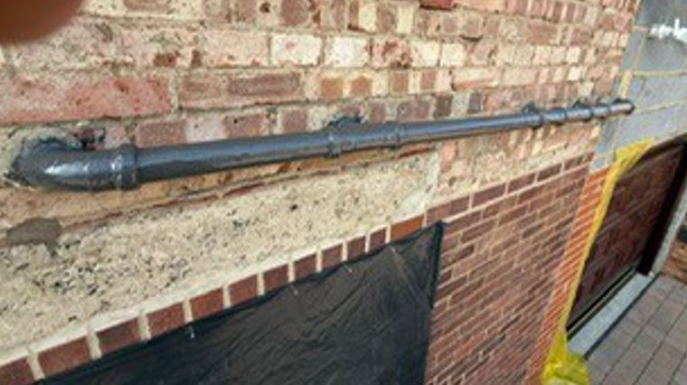 Liquid Metal Epoxy Coating used during the strengthening of an external plastic waste pipe