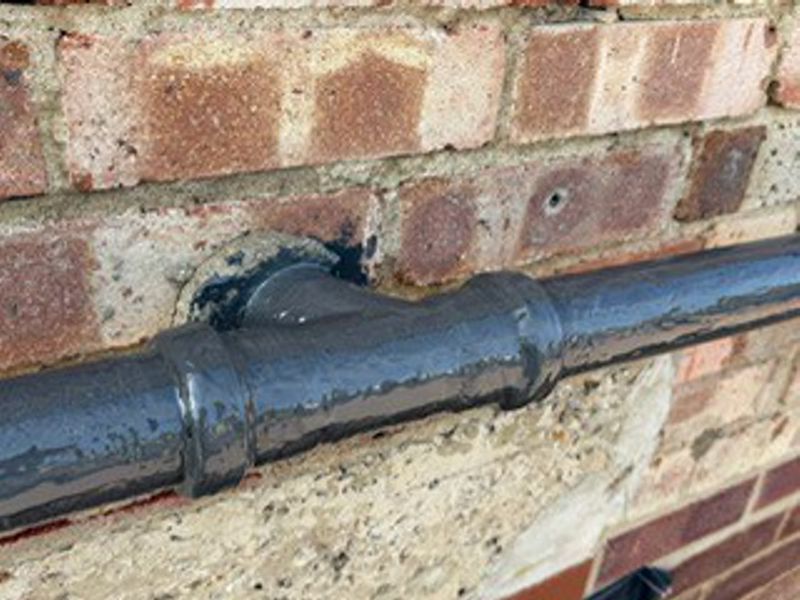 Leaking and weakened joints in a plastic was pipe undergo repair with Liquid Metal Epoxy Coating
